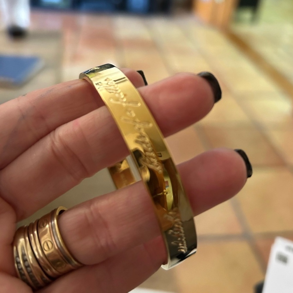 Chic Gold Bangle with Engraved Design Kate Spade friendship